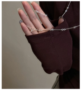 Macro detail of S925 sterling silver bamboo joint chain necklace with metallic luster