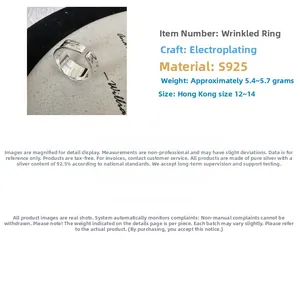 Detailed view of S925 sterling silver ring featuring unique pleated texture and hallmark