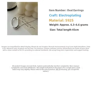 Detailed view of an S925 sterling silver oval pendant necklace in a lifestyle setting