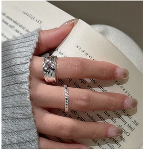 Detailed view of S925 sterling silver rings with pleated and dotted textures