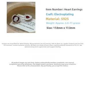 Detailed view of red cameo heart earrings with white rose relief and S925 silver trim