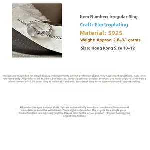 Macro detail of S925 sterling silver irregular wavy ring with translucent white jade stone