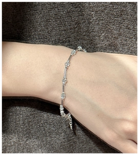 Detailed macro view of S925 sterling silver beaded bracelet with gray crystal stones