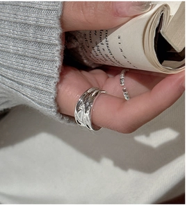 Detailed view of S925 sterling silver ring with irregular liquid metal texture design