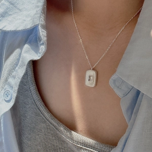 Minimalist S925 sterling silver necklace featuring a square zircon pendant on model