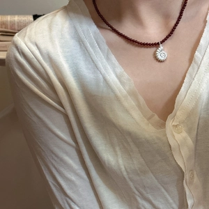 S925 silver nautilus pendant necklace with red agate beads shown on a model