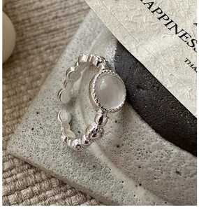 Detailed macro view of S925 sterling silver ring featuring a wave texture and S925 stamp