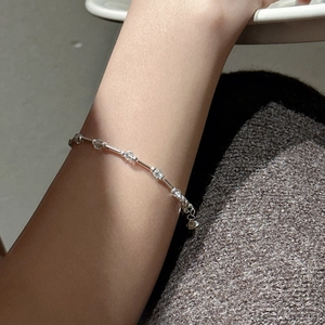Minimalist S925 silver bracelet with blue aquamarine beads worn on a model's wrist