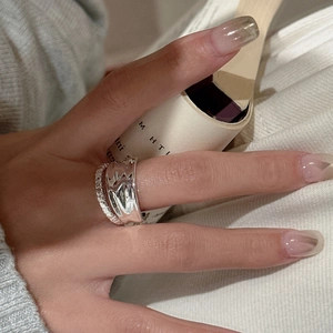 S925 sterling silver ring set with irregular lava texture and slim zircon band on model hand