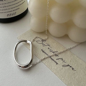 Minimalist S925 sterling silver necklace featuring an irregular hollow oval pendant design
