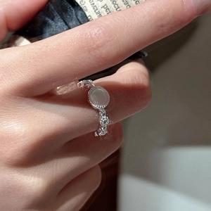 Vintage S925 sterling silver ring featuring a round moonstone with intricate lace band detail