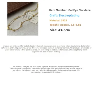 Macro detail of S925 sterling silver beaded necklace with cat eye stone plating finish