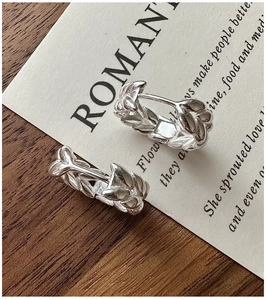 Macro shot of S925 sterling silver hoop earrings with wheat ear leaf textured pattern