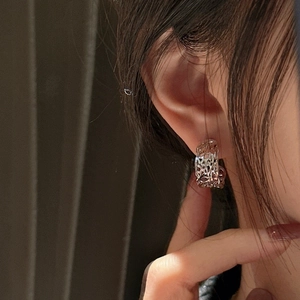 925 silver hoop earrings with vintage CNC cut hollow mesh texture on a model