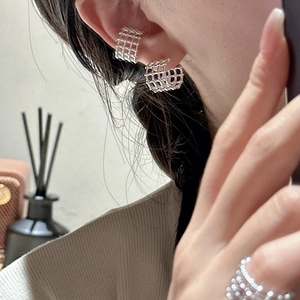 Minimalist S925 sterling silver hollow checkered earring cuff and ring set on a model