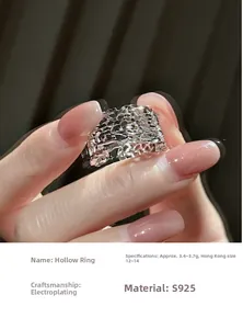 Detail of S925 sterling silver hollowed-out ring with electroplated finish on finger