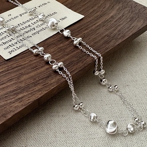 Minimalist S925 sterling silver cat eye beaded necklace on rustic wood and linen cloth