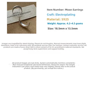 Macro detail of crescent moon S925 sterling silver earrings with matte finish