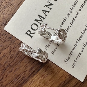 S925 sterling silver hoop earrings featuring embossed wheat leaf patterns on wooden background