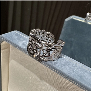 Detail of S925 sterling silver ring with wide lattice hollow geometric design