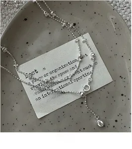 Detail of S925 sterling silver beaded chain necklace with adjustable sliding clasp and zircon
