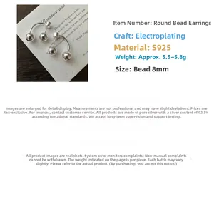 Detail view of 8mm S925 sterling silver ball earrings with minimalist drop style