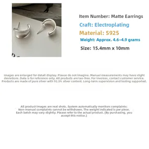 Detail view of 925 sterling silver C-shaped earrings with a matte brushed finish and wide curve