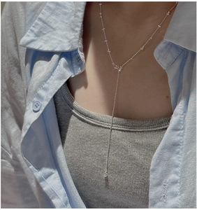 Close-up of S925 sterling silver Y-shaped necklace featuring delicate butterfly charms