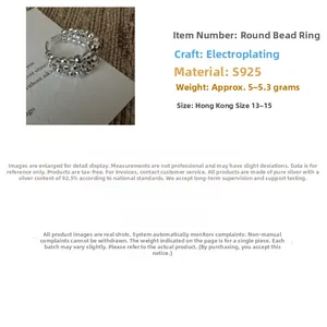 Close-up of triple-layered S925 sterling silver beaded ring with polished finish