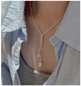 Detailed macro view of S925 silver Y-shaped necklace with elegant shell pearl tassels