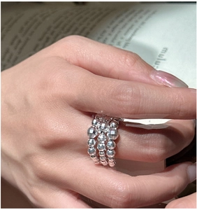 Detail of S925 sterling silver triple-layer beaded ring with sparkling faceted cut metal beads