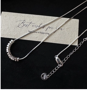 Detail of S925 sterling silver snake chain necklace featuring engraved AG925 hallmark tag