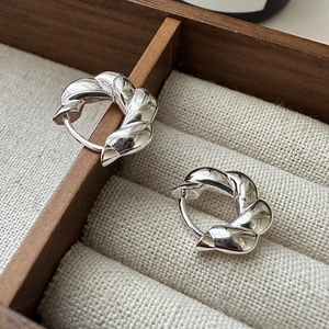 Polished S925 sterling silver twisted hoop earrings with a sleek minimalist braided design