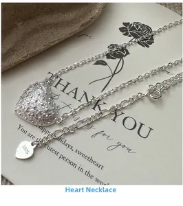 Macro shot of S925 sterling silver heart necklace with unique textured pendant details