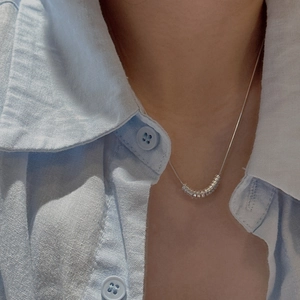 Minimalist S925 sterling silver necklace featuring multi-slide tube pendants on model