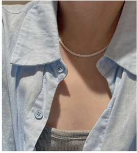 Detail of S925 sterling silver shimmering adjustable necklace worn on collarbone