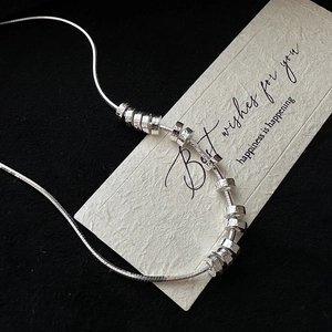 S925 silver minimalist snake chain necklace with hammered ring pendants on card