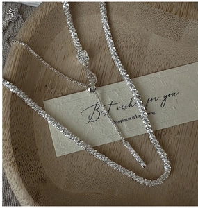 Macro shot of S925 sterling silver textured chain necklace with adjustable slider bead