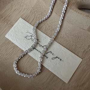 Minimalist S925 sterling silver woven texture necklace on a wooden tray decor
