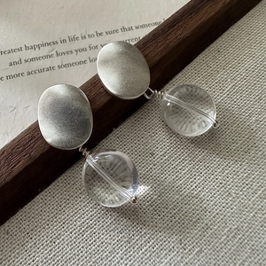 Minimalist S925 sterling silver matte oval earrings with clear round beads on canvas
