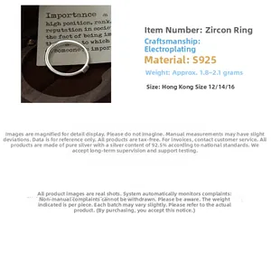 Macro detail of S925 sterling silver ring with cubic zirconia on a wooden display