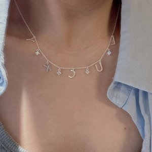 S925 sterling silver LUCKY letter necklace with sparkling crystals worn on the collarbone