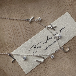 Minimalist S925 sterling silver LUCK necklace with round cubic zirconia pendants