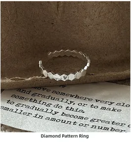 Close-up of S925 sterling silver ring with CNC geometric rhombic texture and adjustable opening