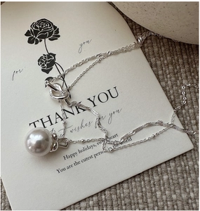 Close-up of S925 sterling silver double-layer necklace with a lustrous large pearl pendant