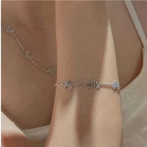 Close-up of S925 sterling silver heart bracelet and necklace set with pavé cubic zirconia
