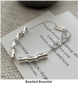 Macro detail of 925 sterling silver bamboo joint chain bracelet with S-hook clasp