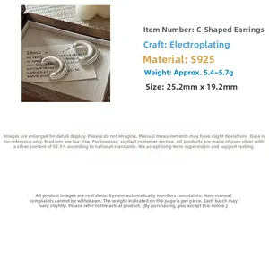 Macro detail of S925 sterling silver C-shaped earrings with matte finish and 25mm size