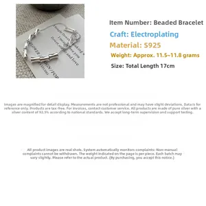 Detail of S925 sterling silver bamboo link bracelet with polished finish and secure clasp