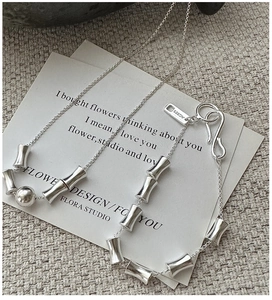 Detailed view of S925 sterling silver bamboo joint chain bracelet with metal bead and S-clasp
